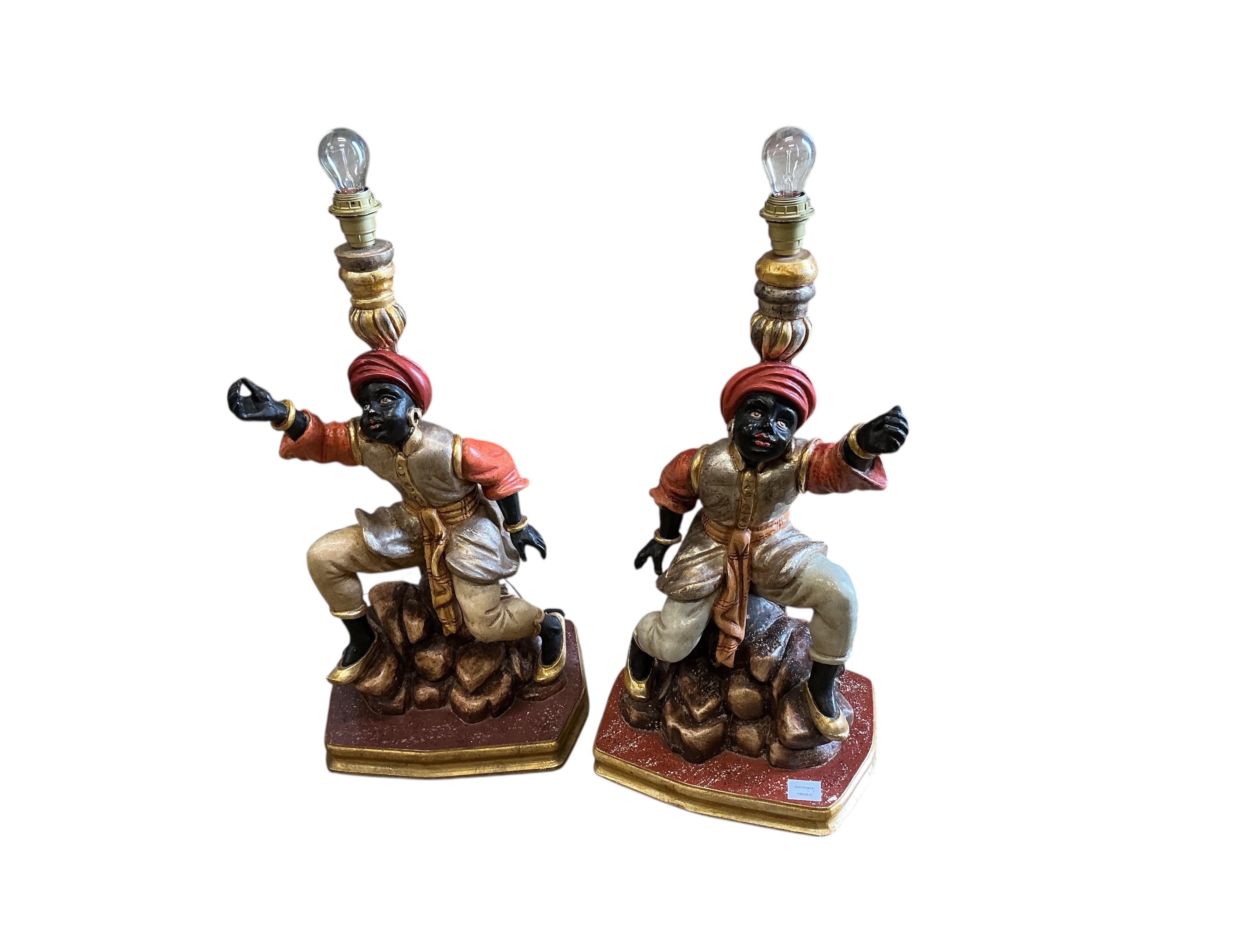 A pair of Venetian style Blackamoor table lamps, height including shades 93cm